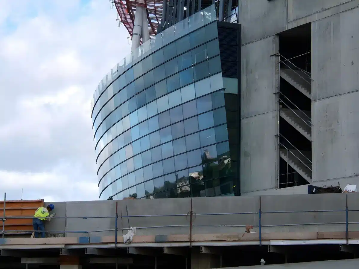 Construction crew working on a modern college stadium facility upgrade