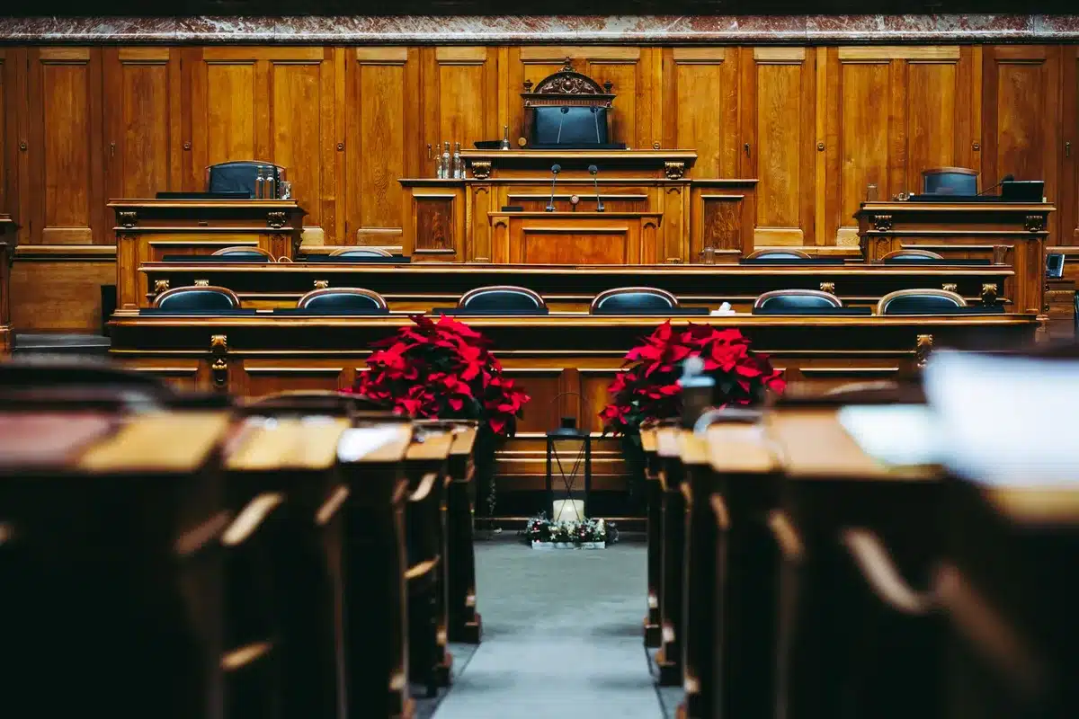 Two lawyers in courtroom engaged in cross-examination and legal argument