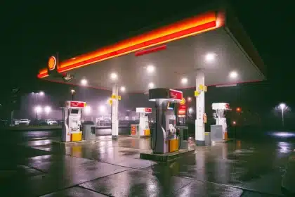 Gas pump with elevated price display and nozzle, symbolizing rising fuel costs