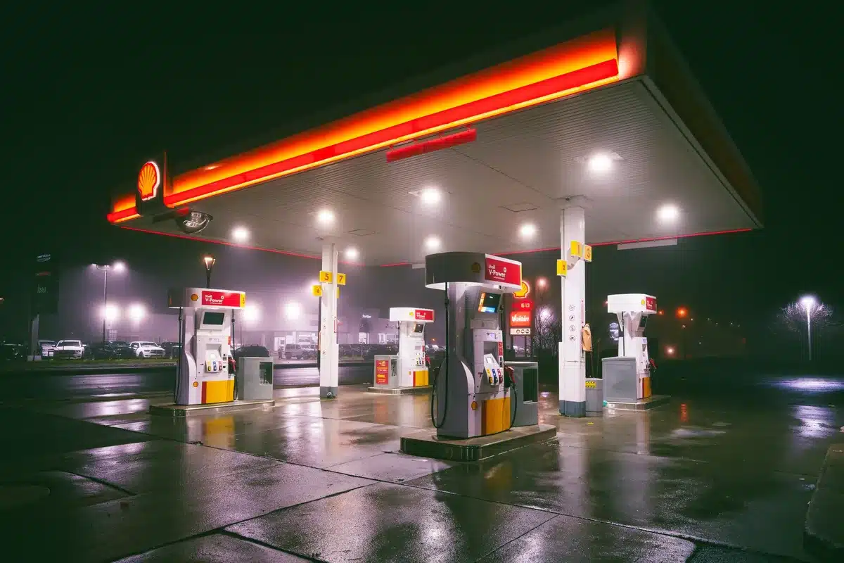 Gas pump with elevated price display and nozzle, symbolizing rising fuel costs