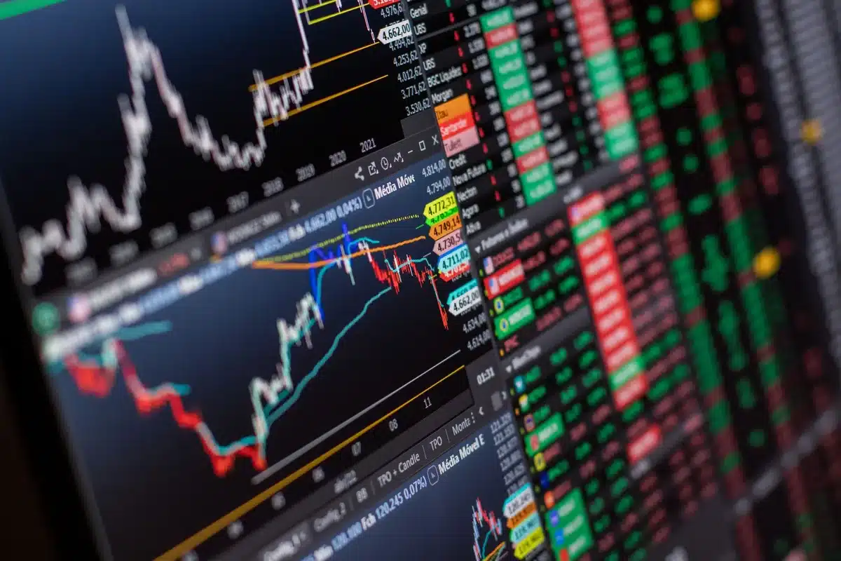 Multiple global stock market indices displayed on trading screens and financial platforms