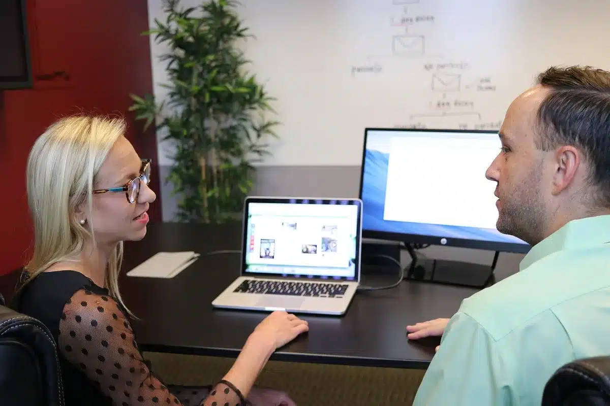 Researchers in discussion around a table planning clinical trial protocols