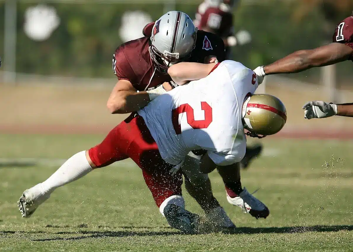 Defensive players in coverage during a third-down situation in college football.