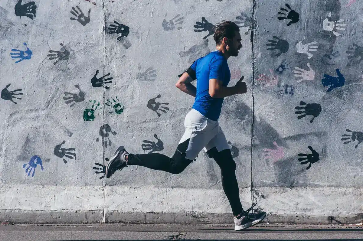 Person stretching and checking a watch before a short run