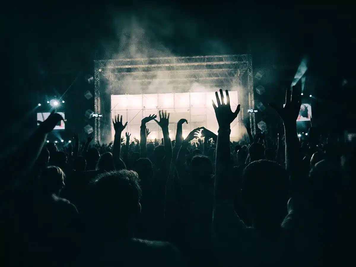 Main stage and a DJ tent at an outdoor festival with audience