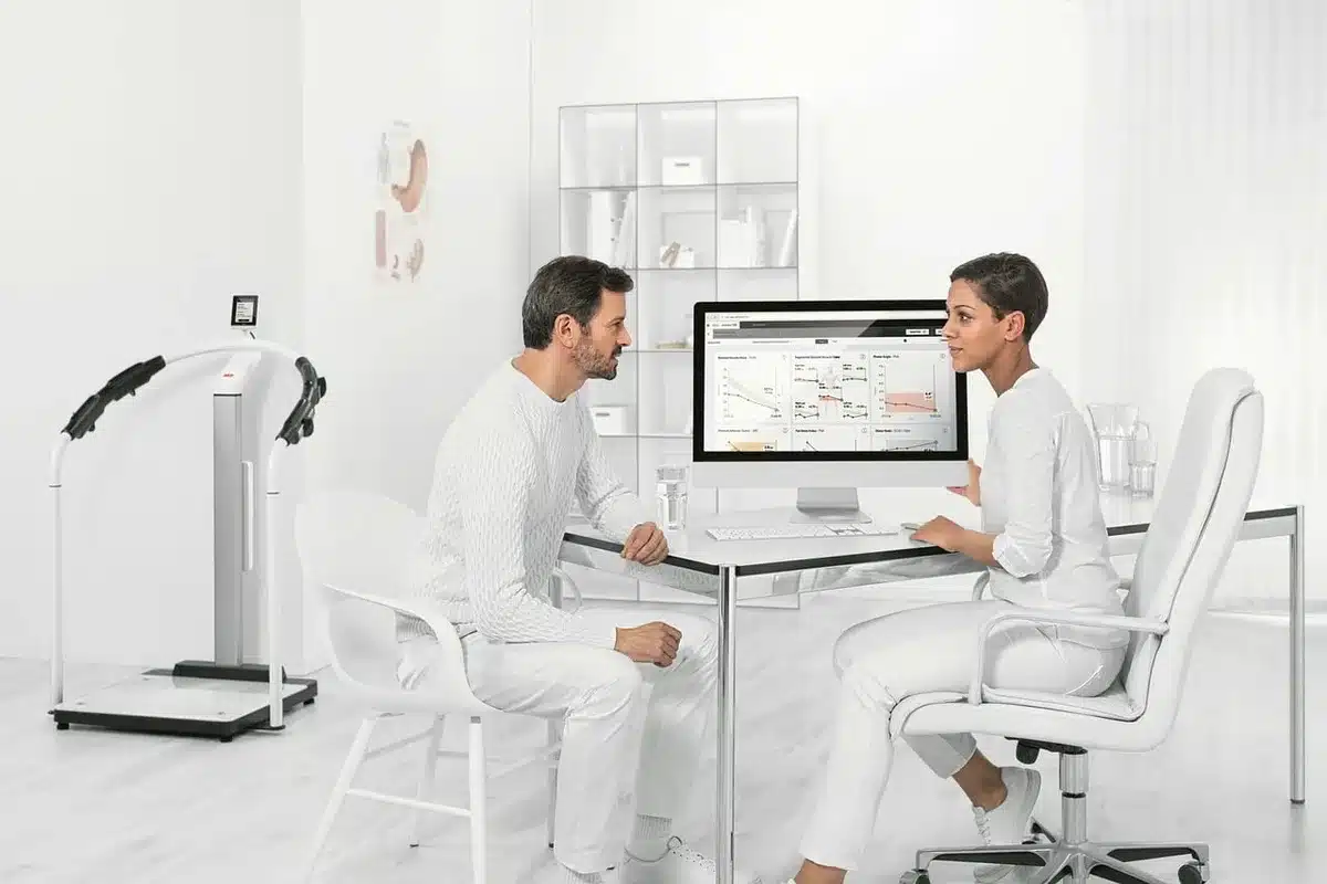 Doctor discussing treatment options with a patient in clinic