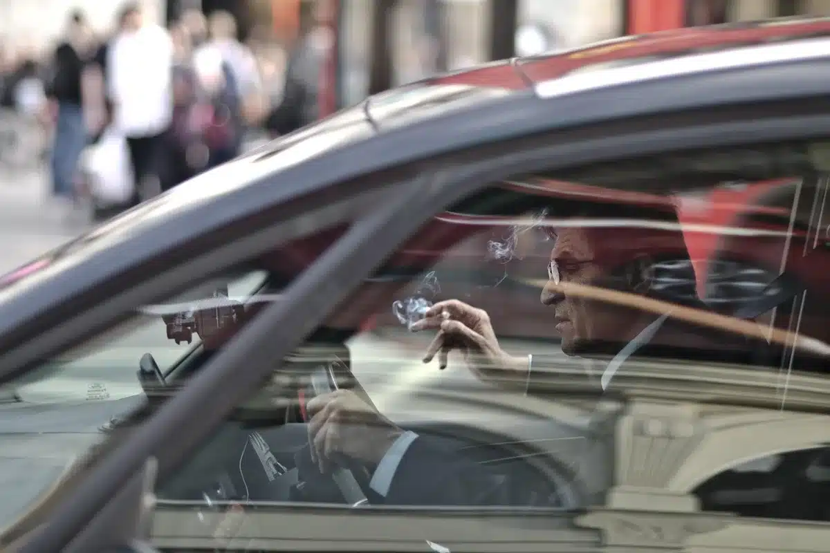 Resident listening to audio news summary while driving