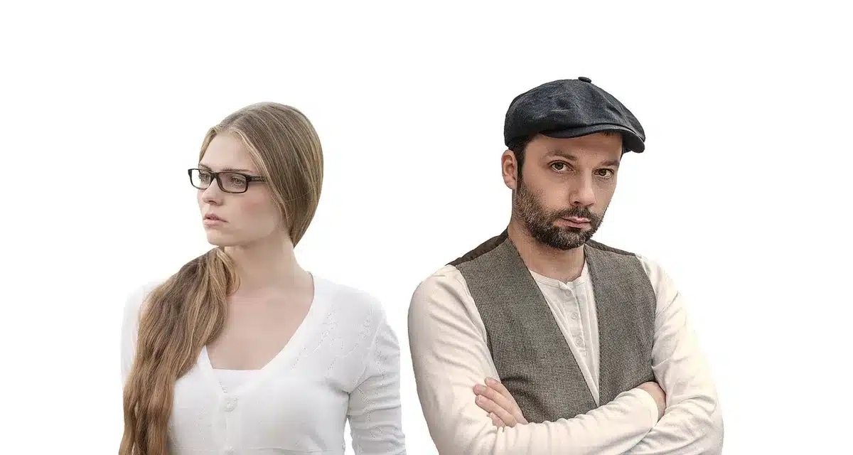 Partners sitting in tense silence, struggling to communicate openly.