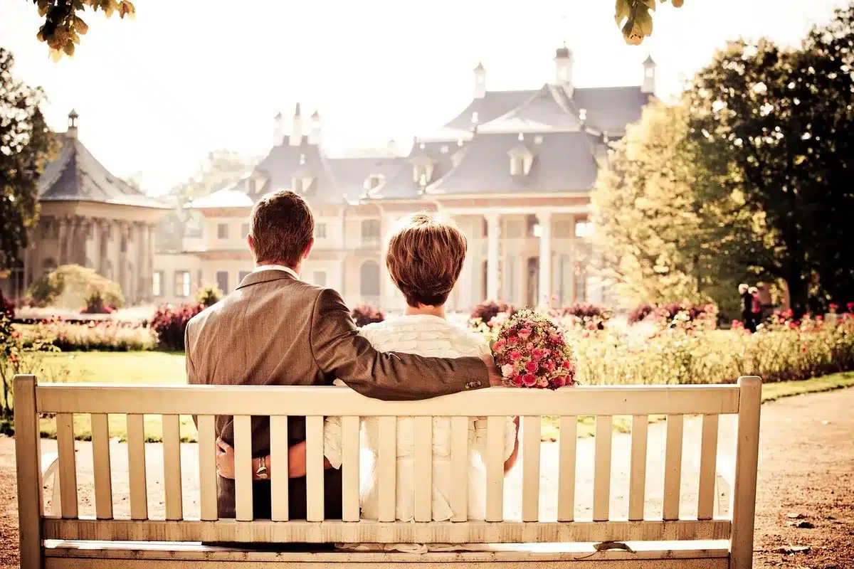 An older couple sitting together at home maintaining daily routines