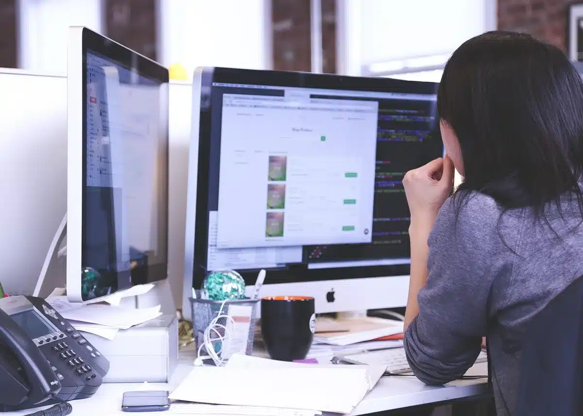 Turner-style community volunteer coordinating at a nonprofit desk