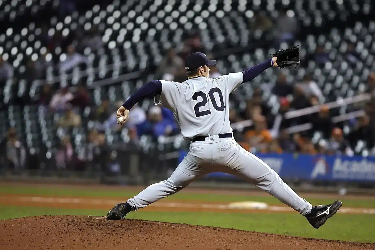 Young starting pitchers on the mound delivering a high-velocity pitch