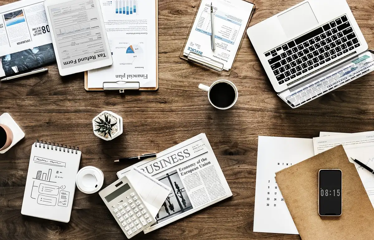 Person organizing ID, income papers and energy bill before applying