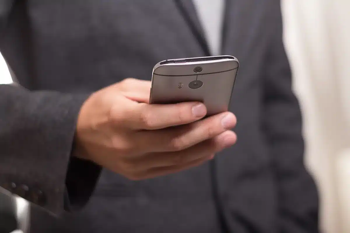 People watching a viral video on smartphones with social app icons visible